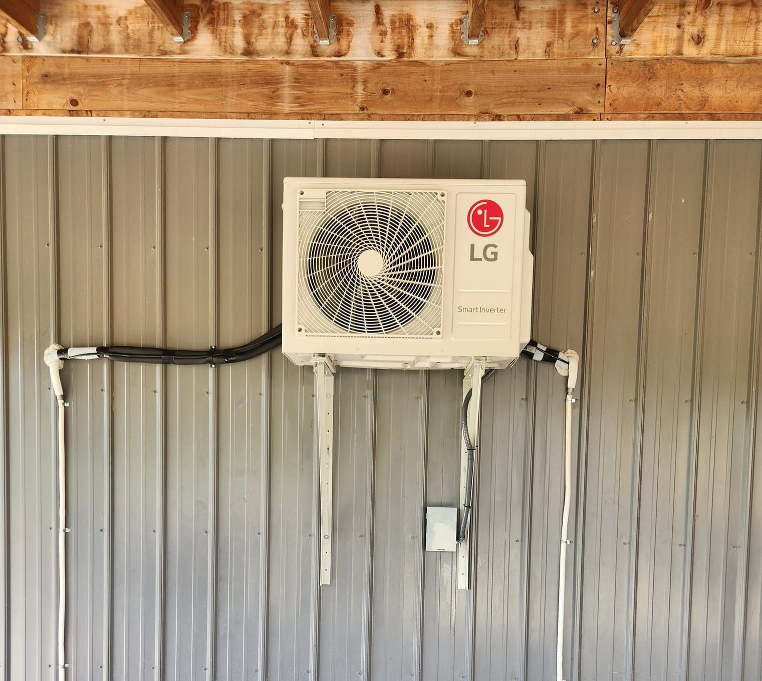 An LG air conditioner is mounted on the side of a building.