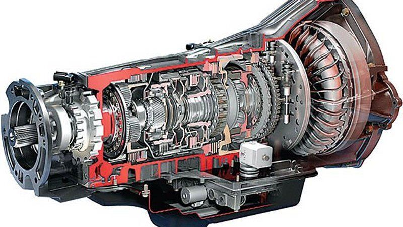 A cutaway view of a car transmission on a white background.