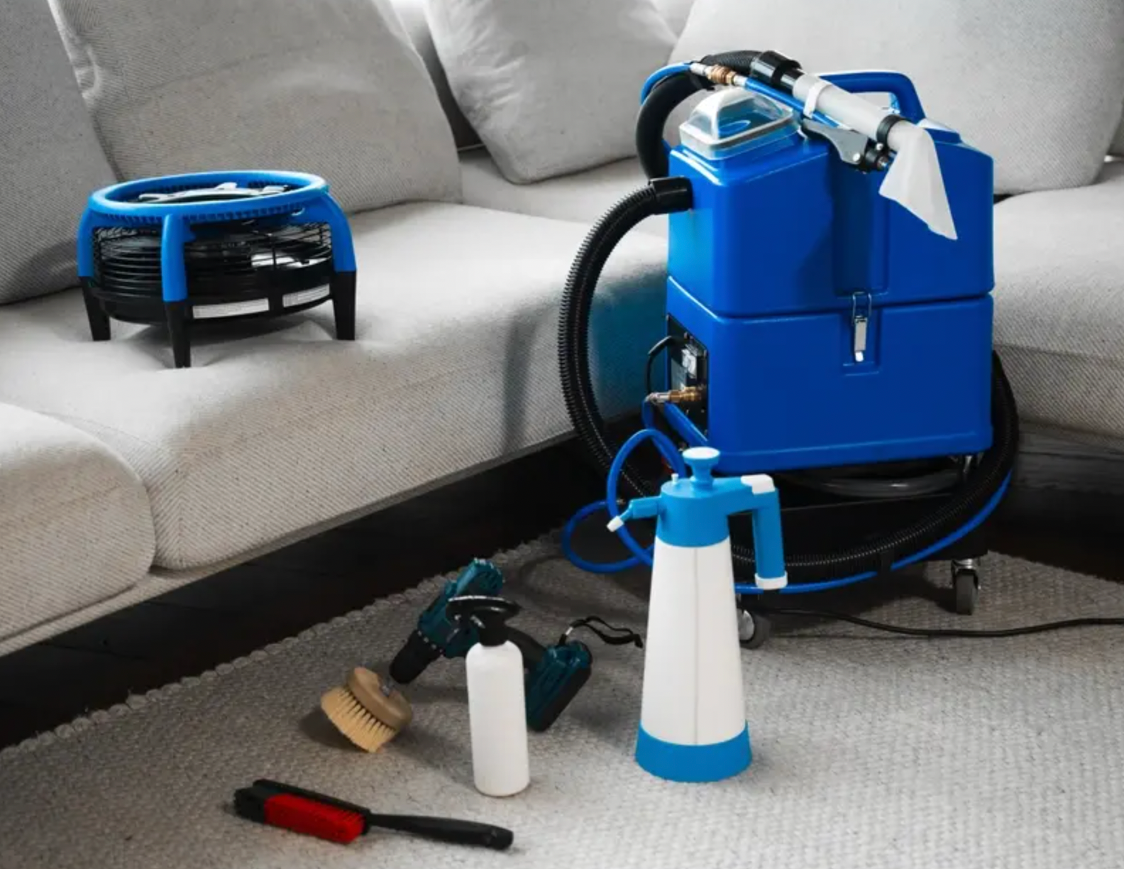 A hallway in an office building with sliding glass doors and a chair.