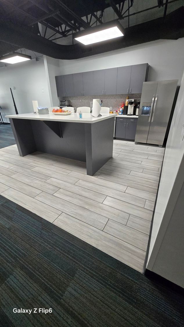 A room with a lot of pieces of wood on the floor and a window.