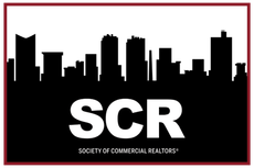 The logo for the society of commercial realtors shows a city skyline.