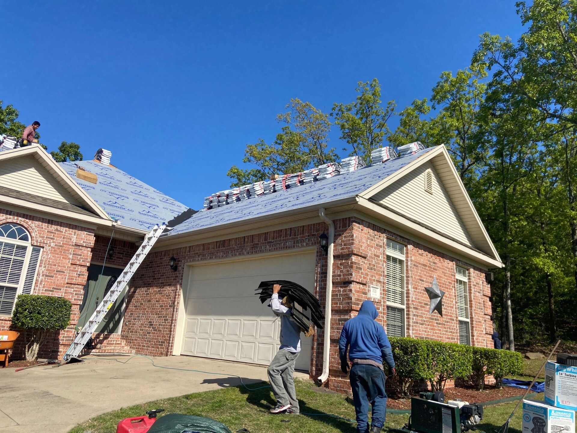 image of a shingle roof replacement in progress