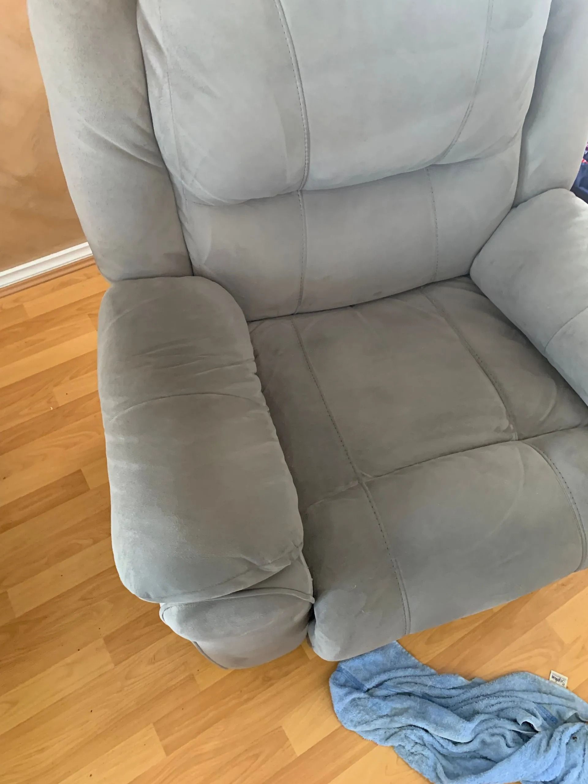 Gray Recliner on Wooden Floor. a Blue Cloth is Partially Visible — Dryology Carpet Cleaning in Nelson Bay, NSW
