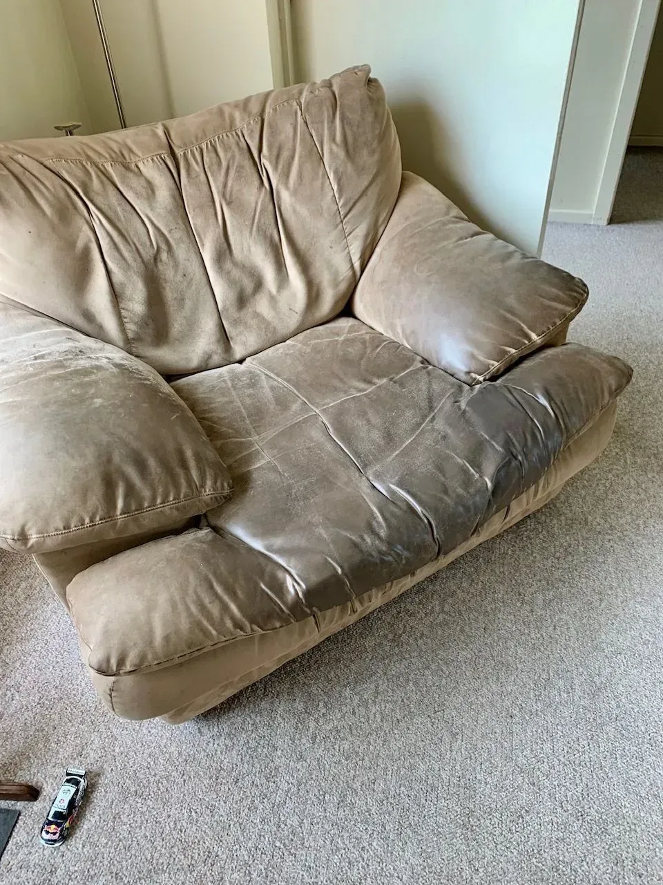 Beige Leather Armchair on Carpet, Showing Wear and Tear — Dryology Carpet Cleaning in Hamilton, NSW