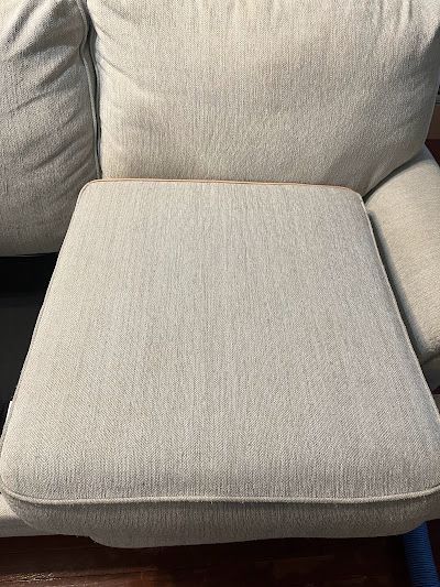 Close-up of a beige sofa cushion.