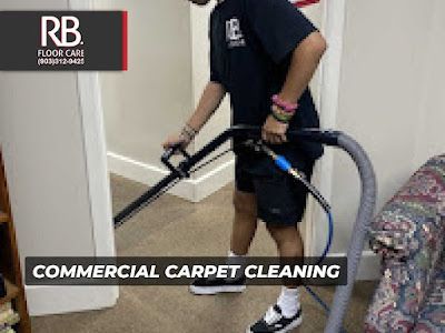 Person cleaning a carpet with a commercial cleaner.