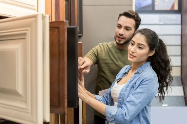 Couple Choosing Cabinets for Their New Home