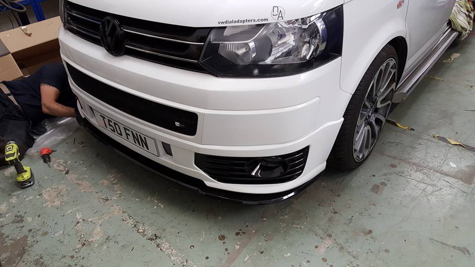 white bumper modifications on the front of a van