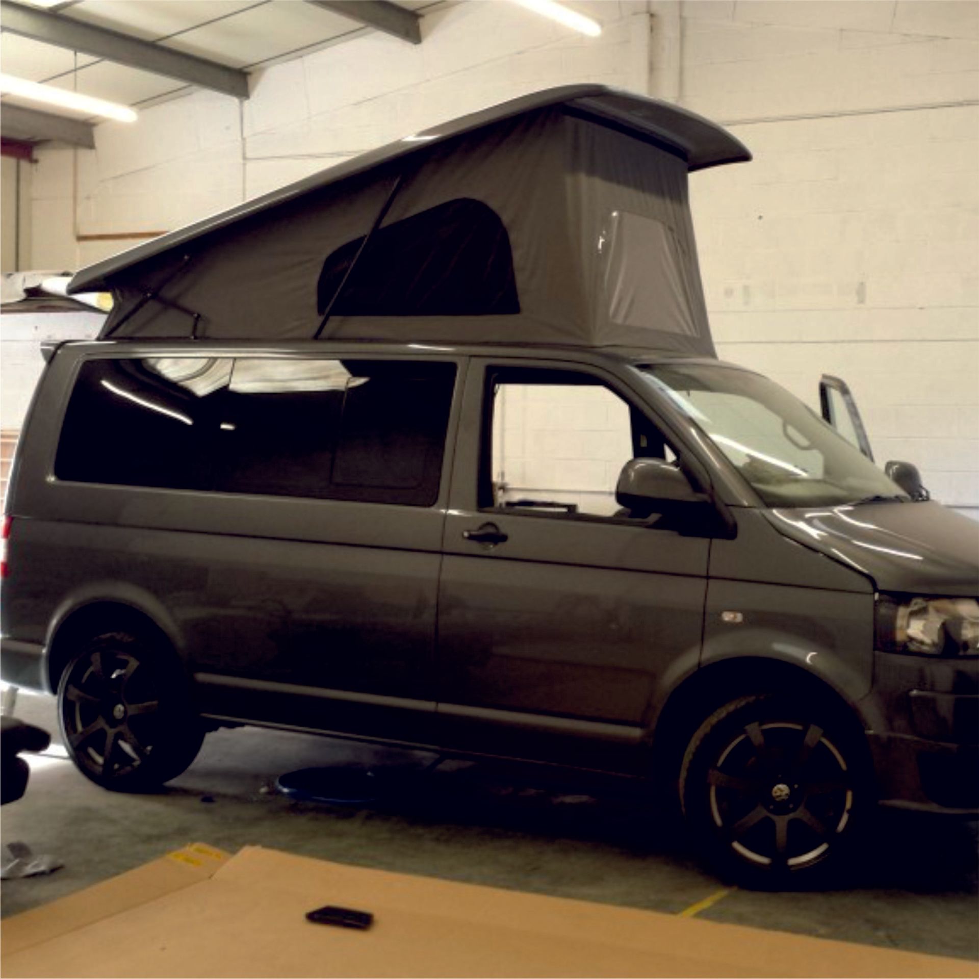 a pop top roof installation on a van
