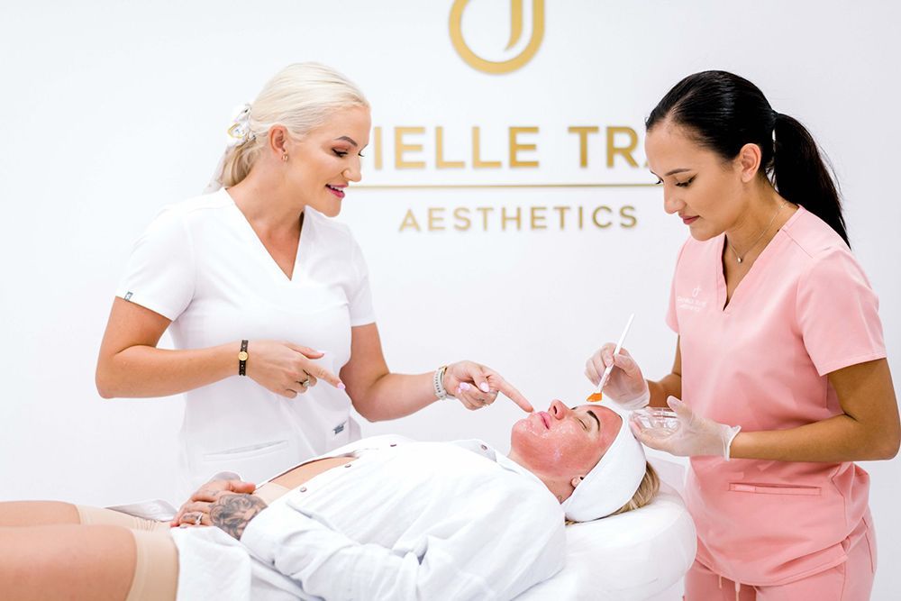 Two cosmetologist with patient applying facial treatment — Cosmetic Procedures in Broadbeach Waters, QLD