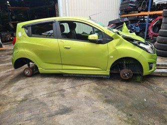 A green car with no tires.