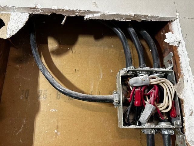 A box with electrical wires coming out of it