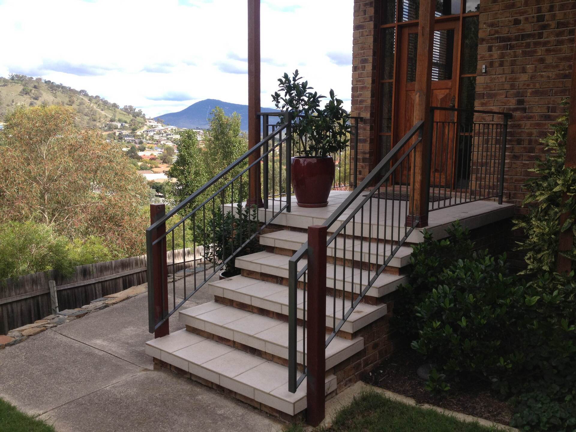 A set of stairs leading up to a brick building