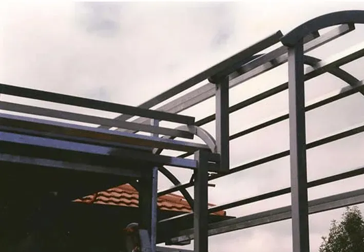 A metal structure with a roof that is being built