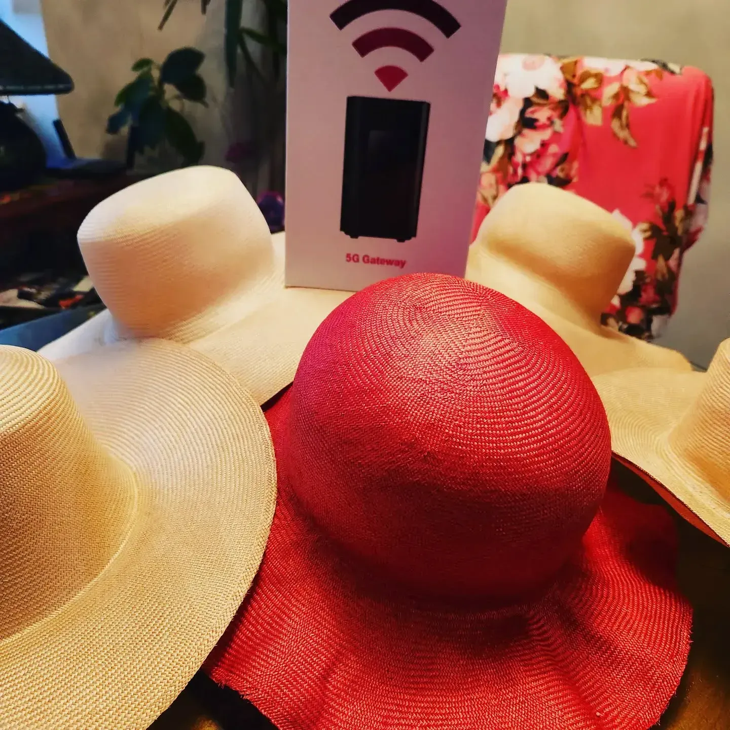 Hats in various shades of beige and red, with a box showing a Wi-Fi signal.