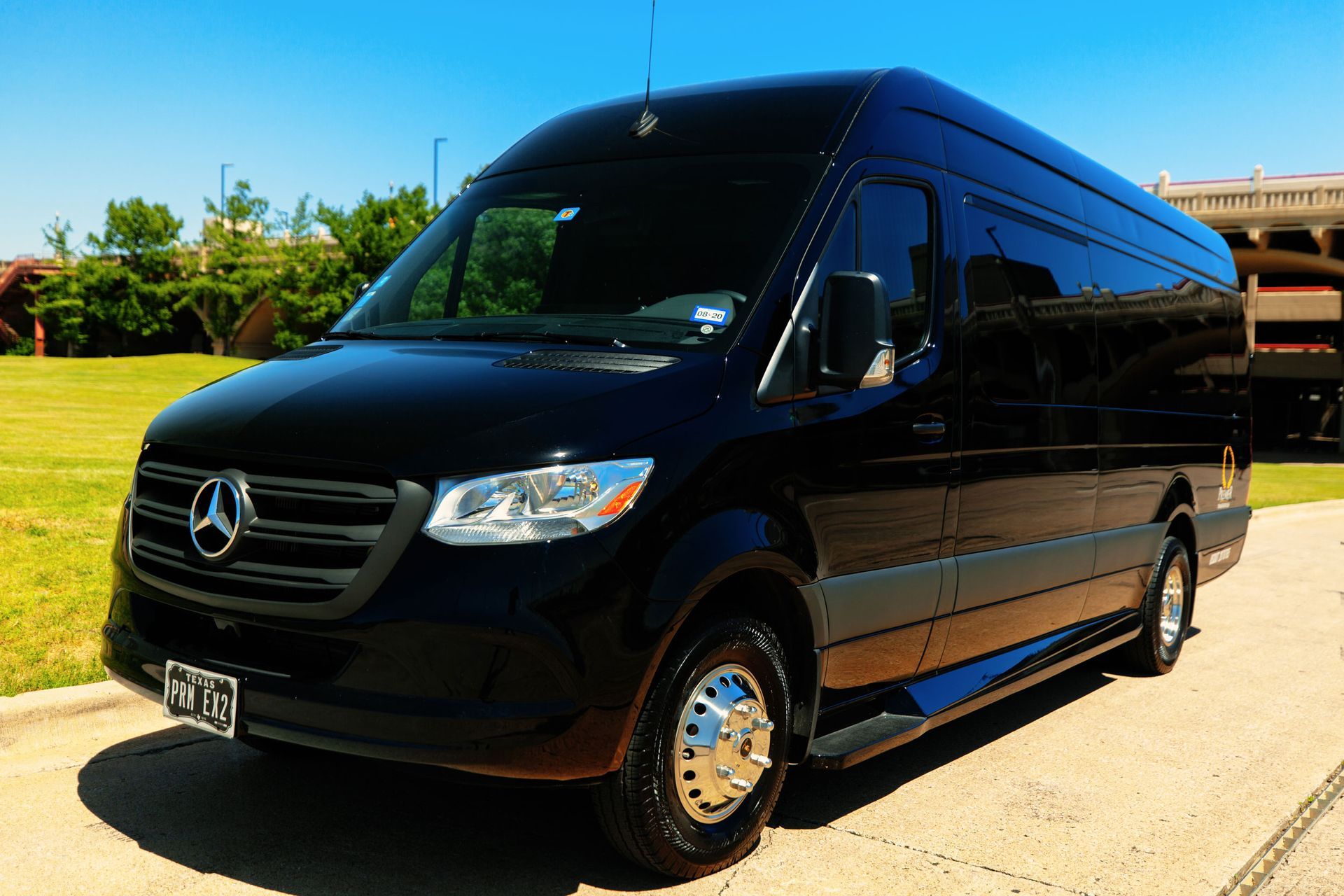 premier's black mercedes sprinter van is parked on the side of the road .