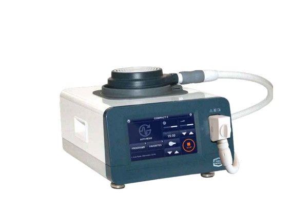 A medical device with a touchscreen interface, a cylindrical applicator, and a white and teal color scheme.