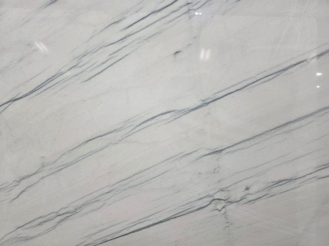 White marble slab with angled gray veining.