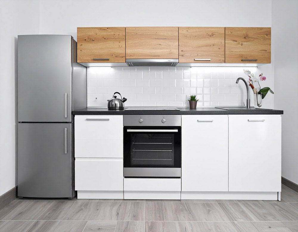 A kitchen with appliances, refrigerator, oven, sink and stove in Meridian, ID