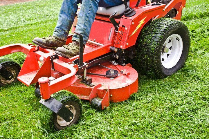 man using a lawn mower
