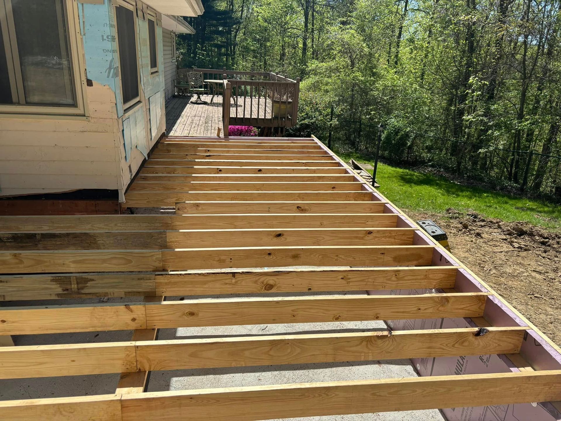 Deck under construction with wood framing.