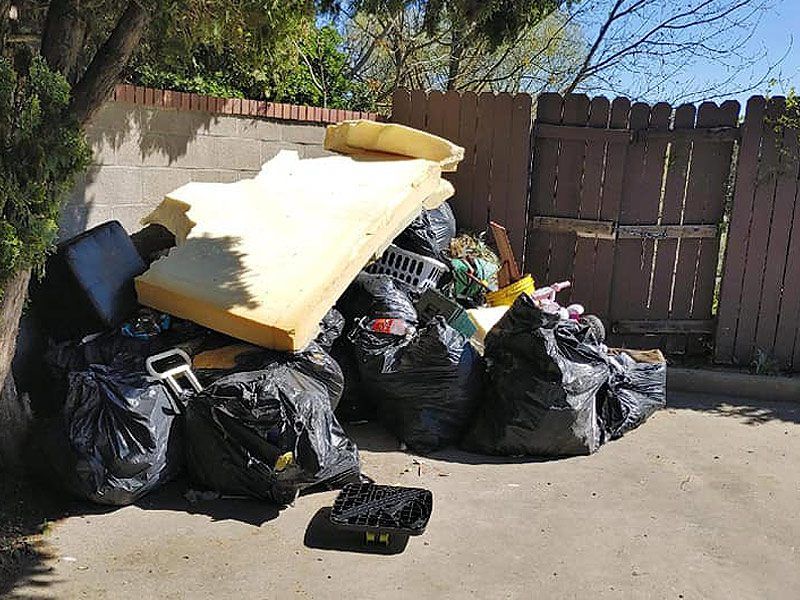 mattress, and other residential junks wrapped in garbage bag
