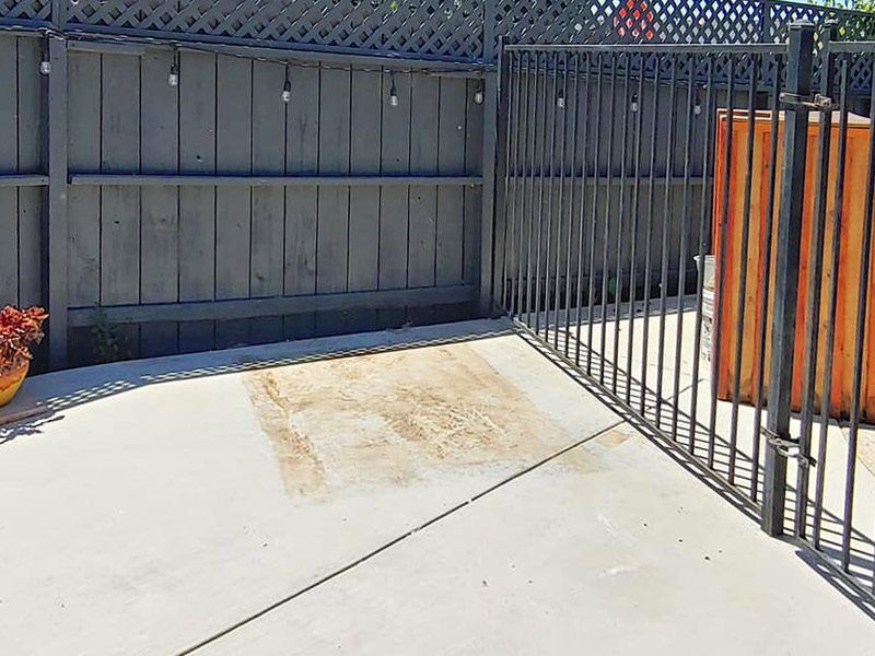 painted fence with junks removed