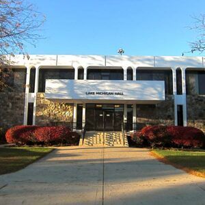 A large white building with a sign that says lake michigan hall
