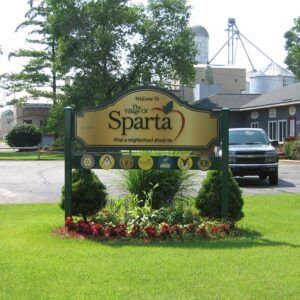 A sign that says the village of sparta on it