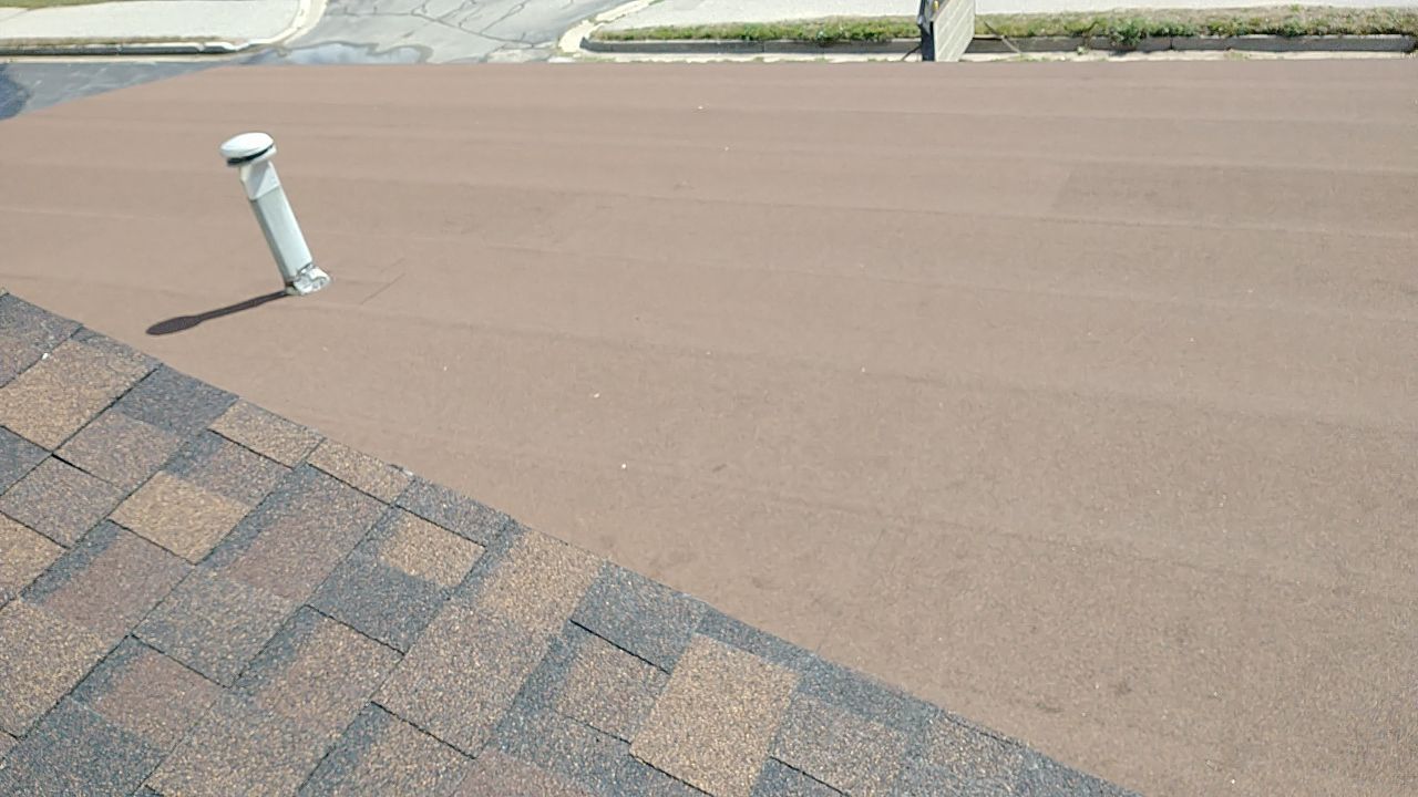 A roof with a chimney on top of it.