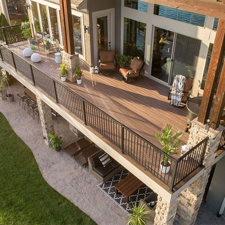 An aerial view of a large deck with chairs and tables