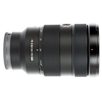 A close up of a camera lens on a white background.