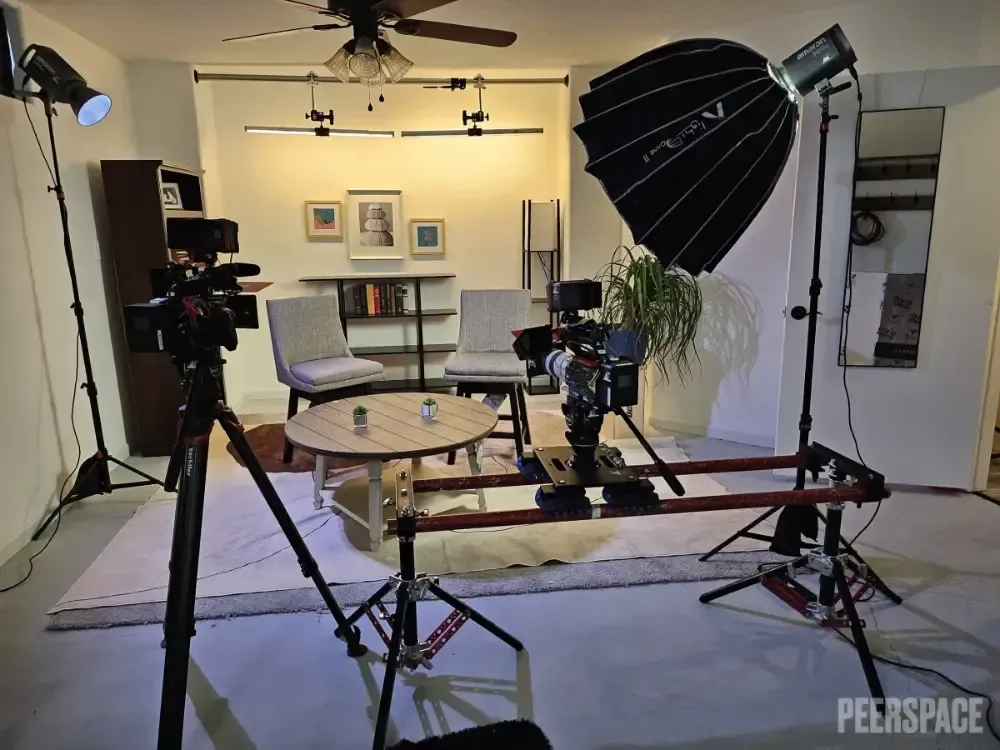 A peerspace studio with a table and chairs