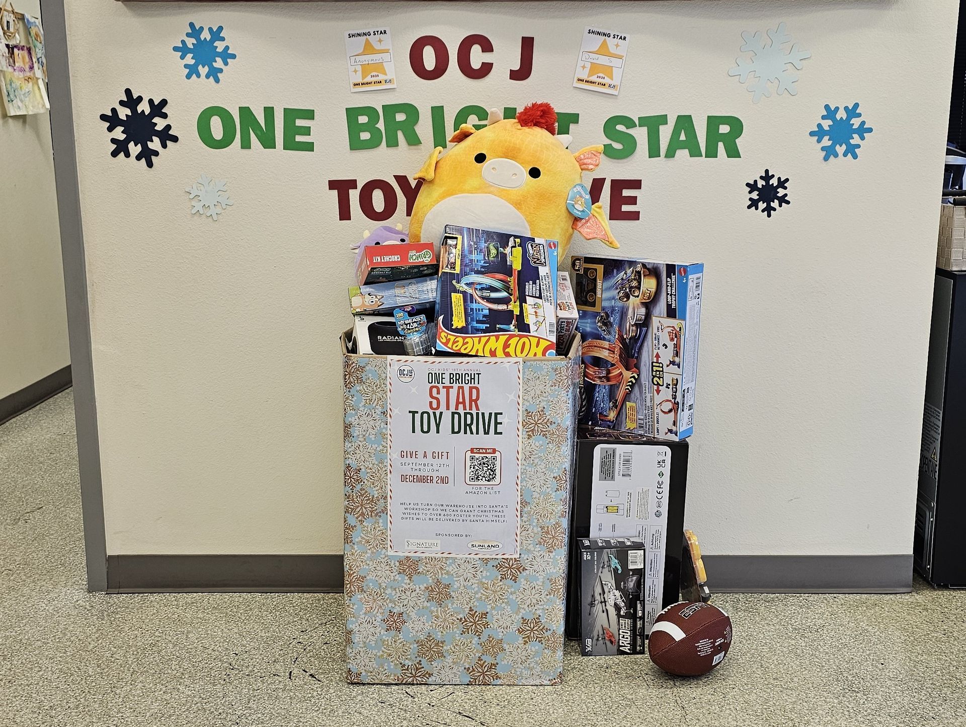 OCJ Toy Drive donation station at Precision Tire and Auto Center