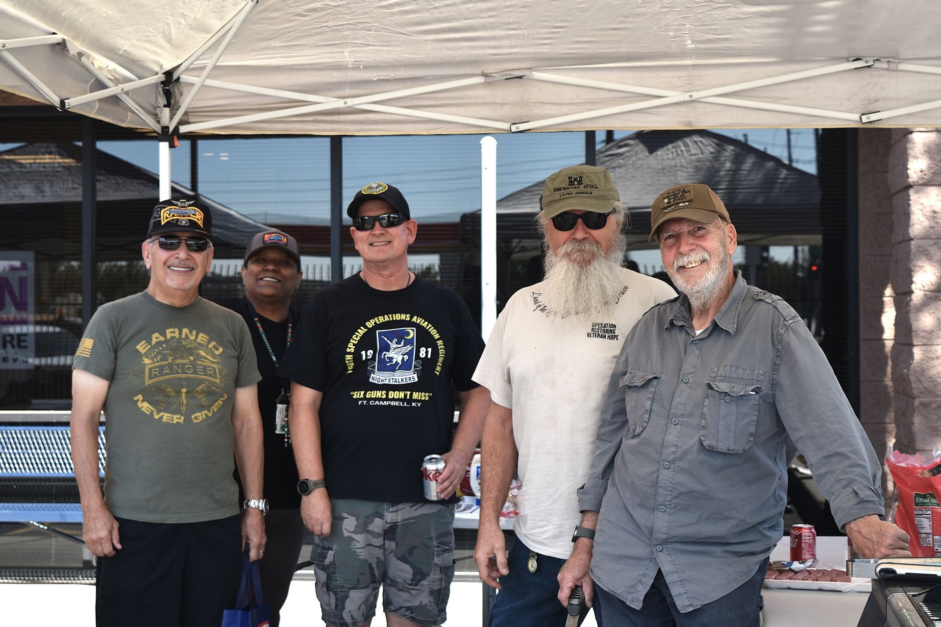 Local veterans spending time together at the shop during the free oil change appreciation event