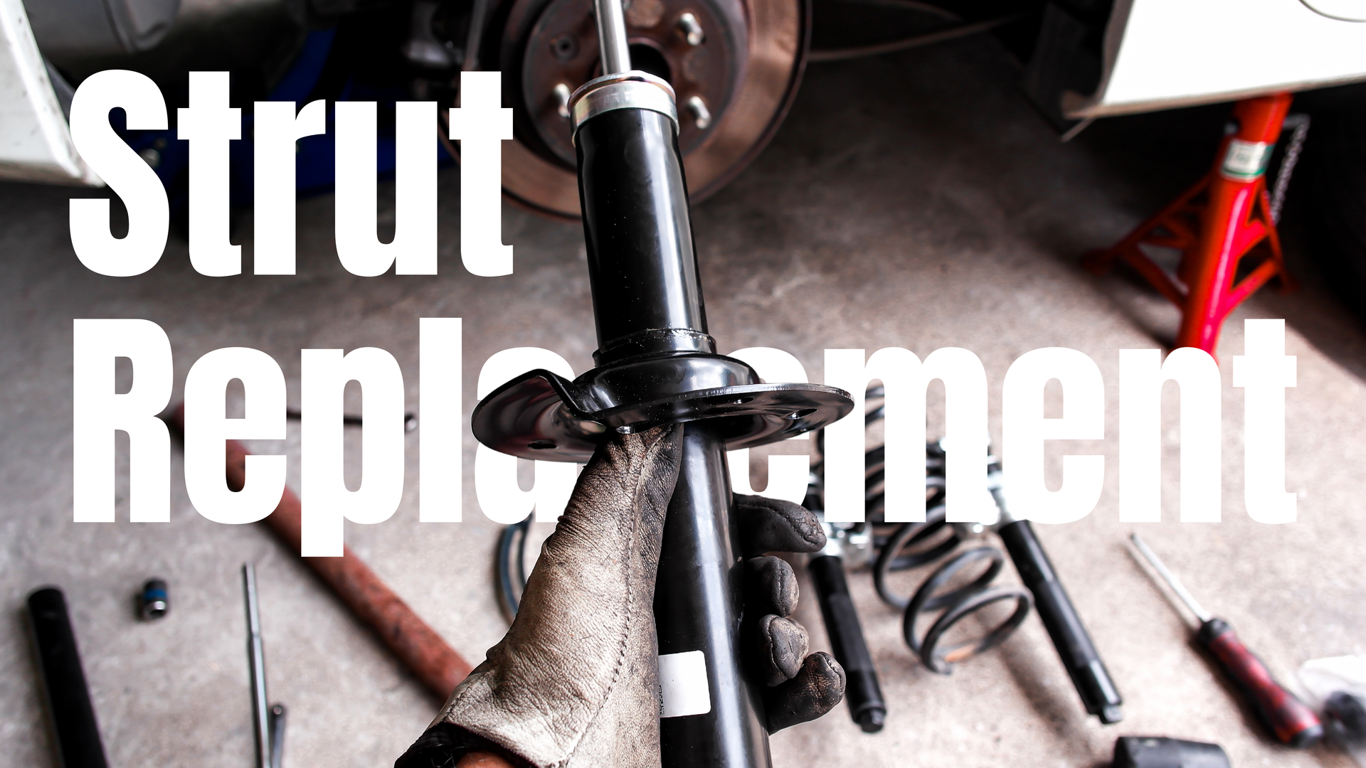 Close-up image of vehicle struts, showing repair parts and highlighting suspension repair components