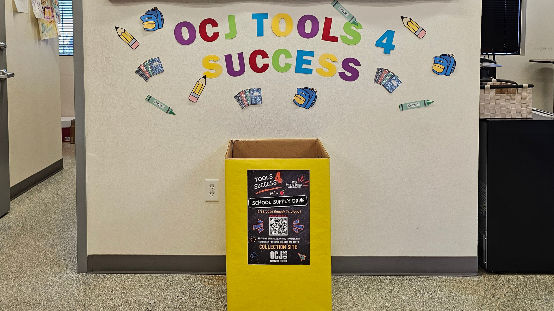 Tools 4 Success school supply donation bin displayed in Phoenix auto repair shop lobby for OCJ Kids