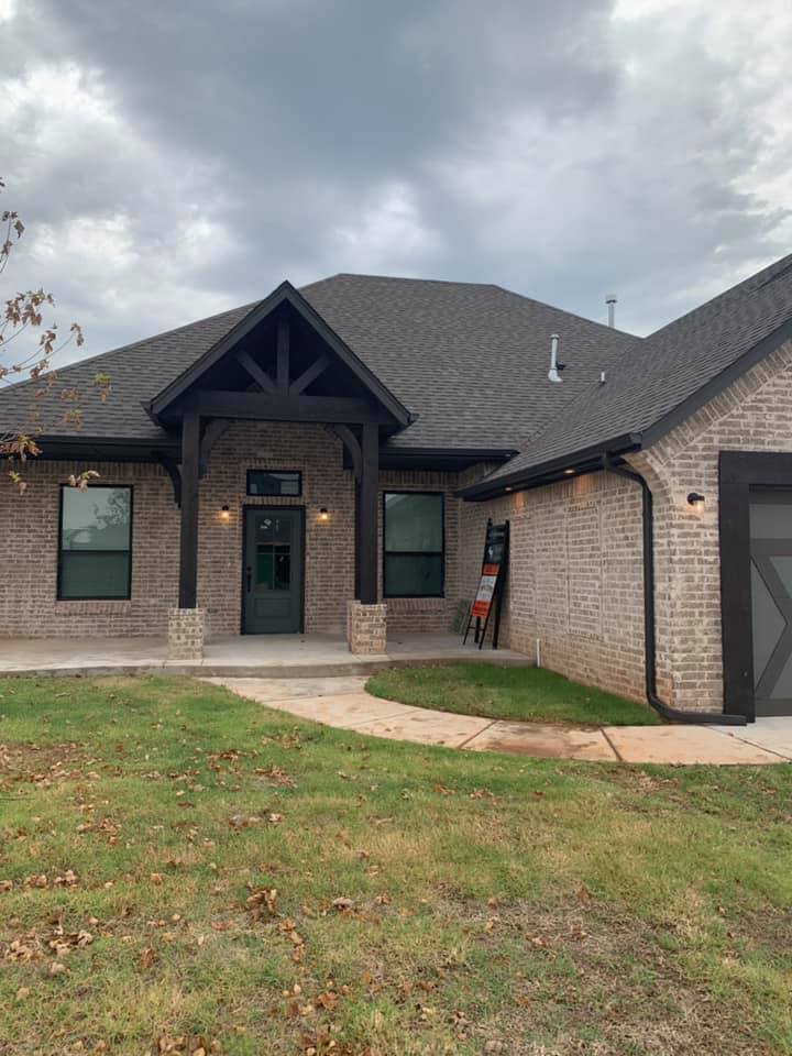 Big House With Black Roof — Oklahoma City, OK — A-Plus Seamless Guttering LLC
