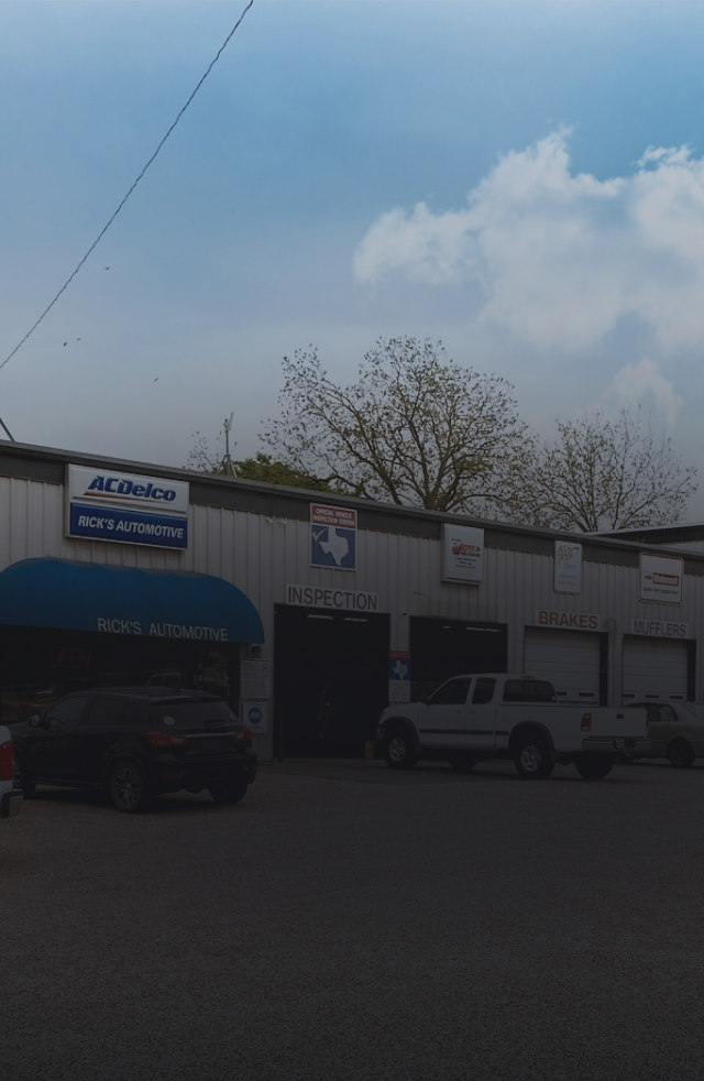 A gray sports car is parked on the side of the road | Rick's Automotive