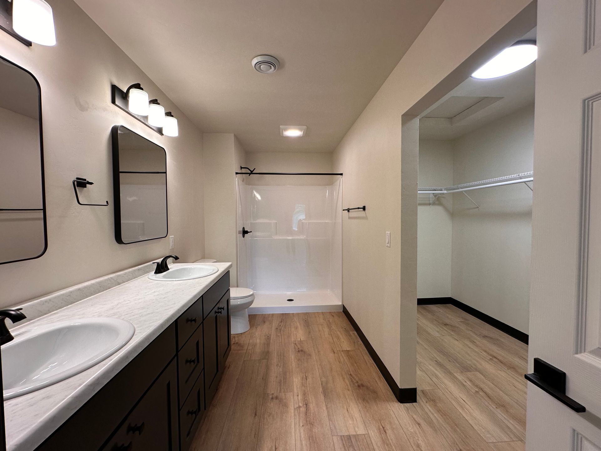 primary bathroom with walk in closet