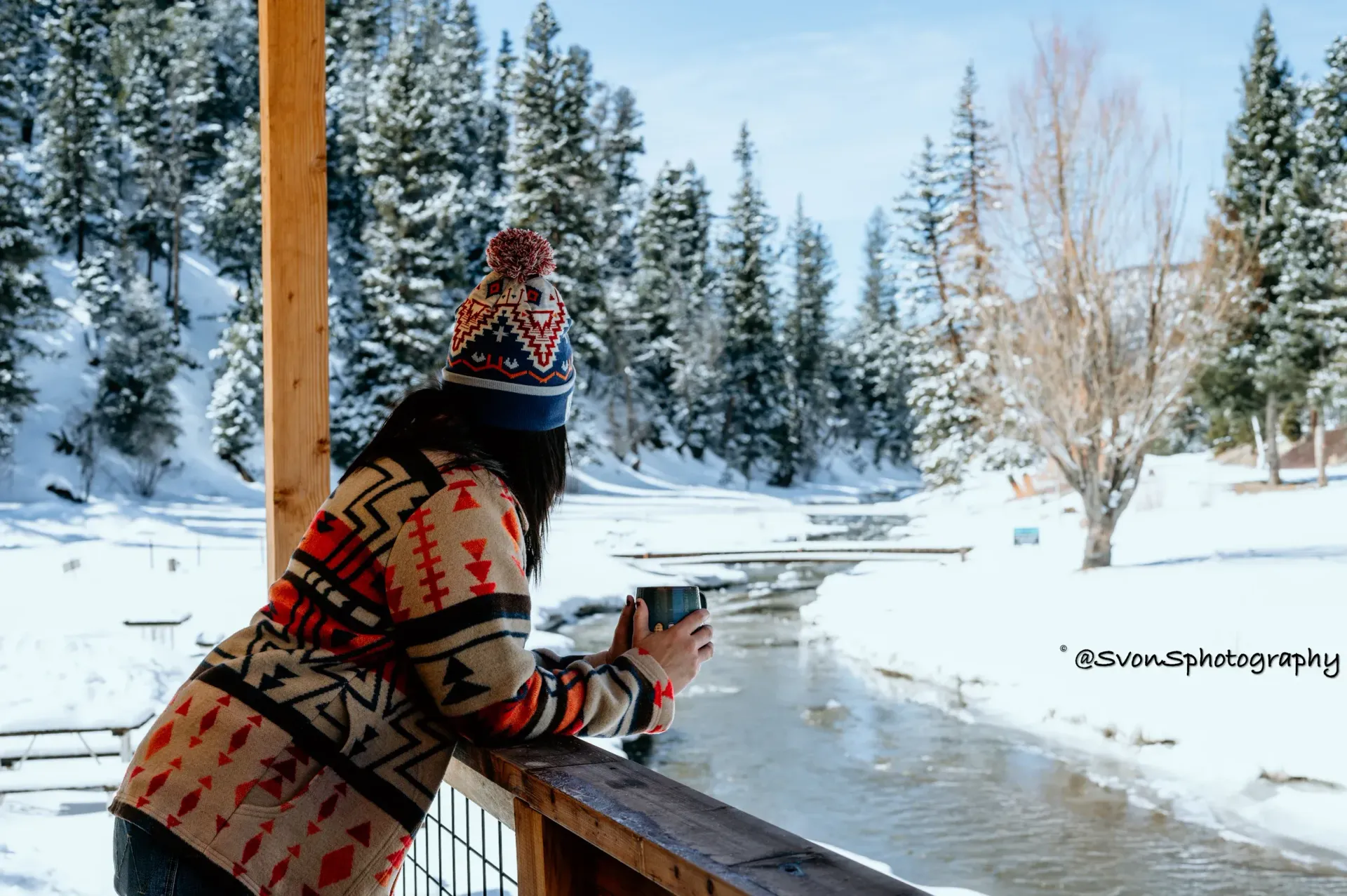 Woman with cup of coffee on porch