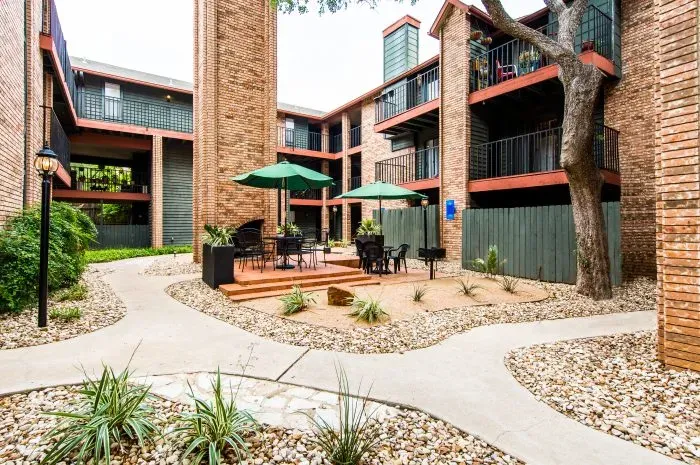 Courtyard with picnic tables and umbrella