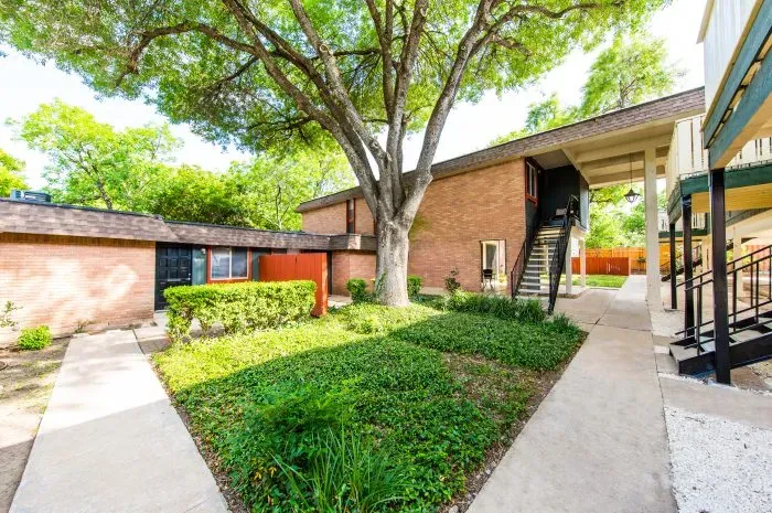 The Colony - exterior of building with grass area and trees