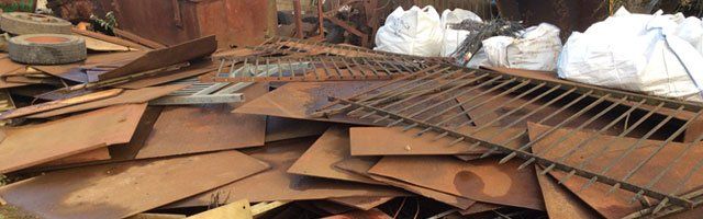 a pile of scrap metal sheeting
