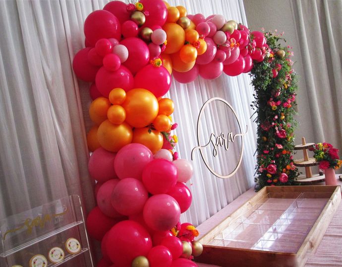 event balloon arch, balloon design, gateshead, north east, newastle, tyneside, balloon wall, event decor, balloon backdrop, balloons and flowers, birthday party balloon decoration, balloon arch with flowers, orange and pink balloons, square balloon arch, organic balloon arch