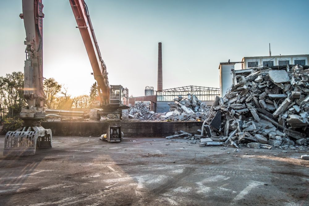 Demolition Site With an Excavator Arm, Rubble Pile — Goat Collective in Lismore, NSW