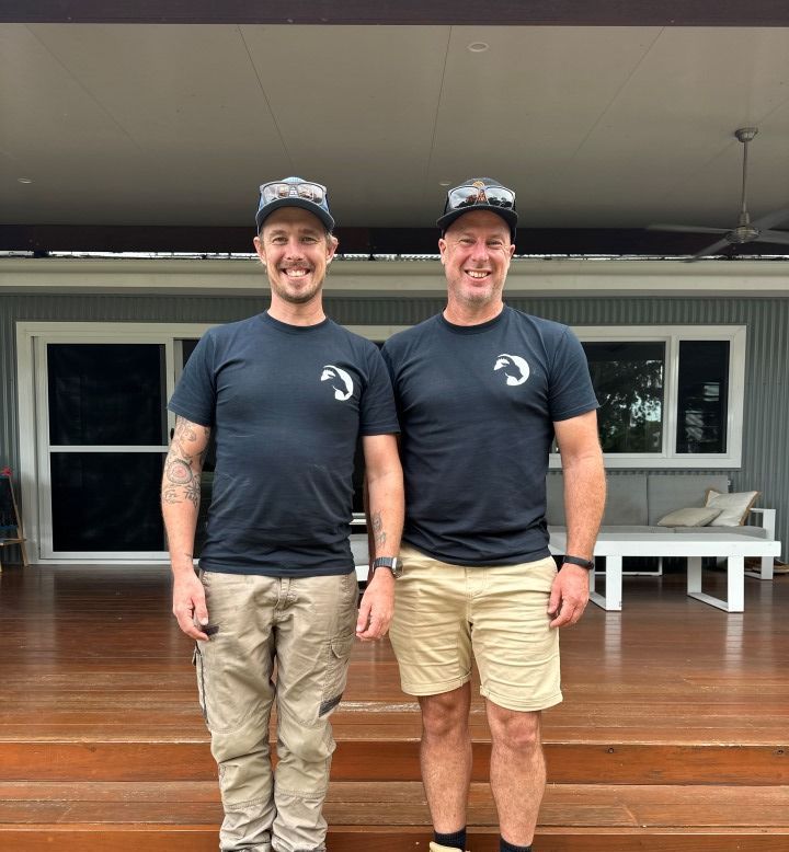 Two Men Standing Next to Each Other in Front of a House — Goat Collective in Tintenbar, NSW