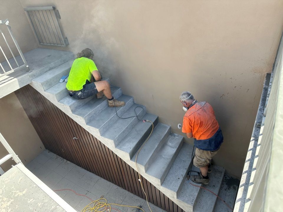 Two Men Are Working on a Set of Stairs — Goat Collective in Tintenbar, NSW