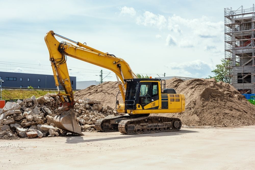 Yellow Excavator on a Construction Site — Goat Collective in Ballina, NSW