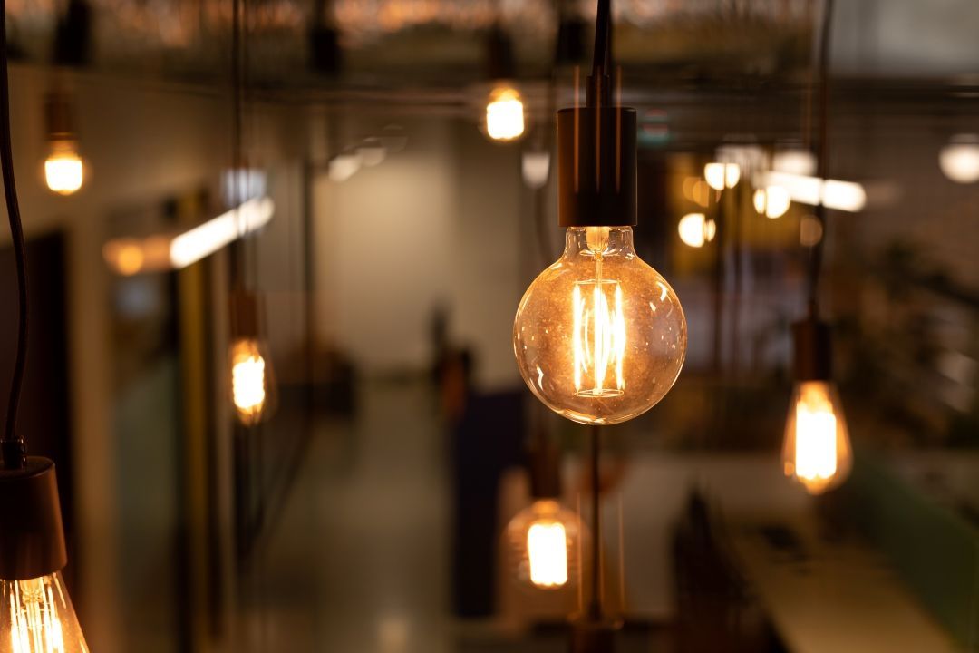 A Bunch of Light Bulbs Hanging From the Ceiling in a Room — Goat Collective in Tintenbar, NSW